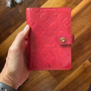 Patent leather monogram Louis Vuitton planner or wallet in pink.